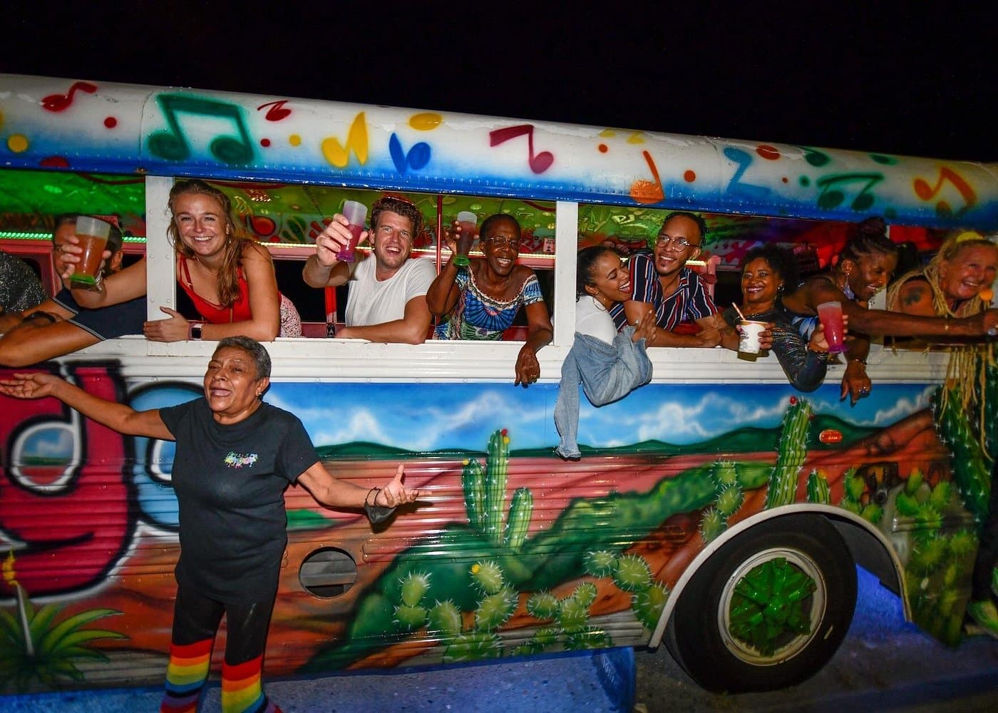 Chogogo Tours party bus parked for an Aruba nightlife stop.